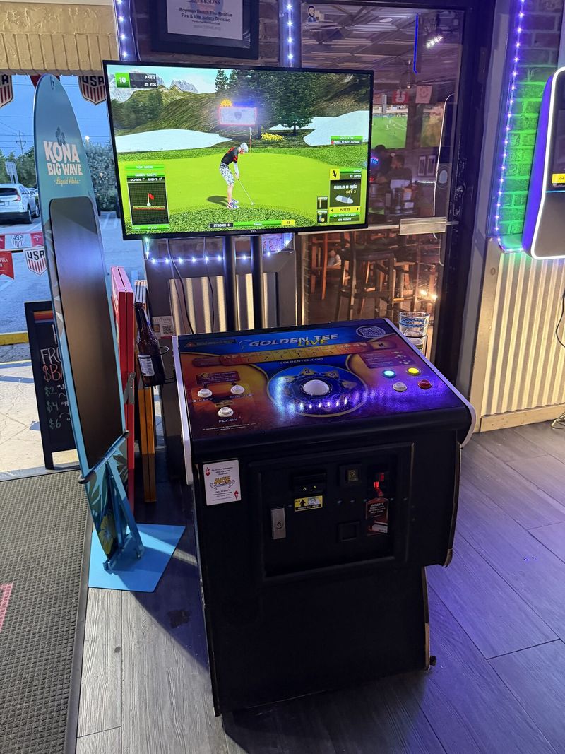 Golden Tee golf arcade game at The Boulevard Bar & Grill