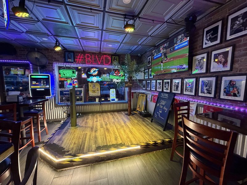 Live music stage with LED lighting at The Boulevard in Boynton Beach